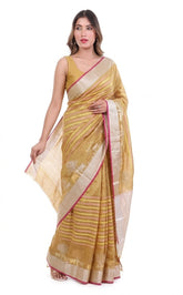 Woman wearing a yellow saree with a white blouse, displayed against a plain background.