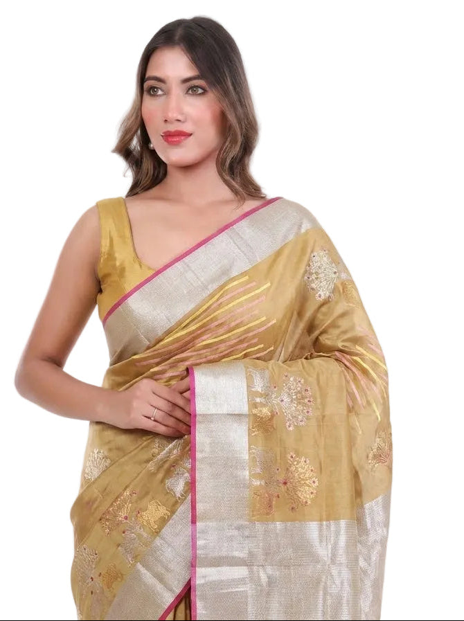 Woman wearing a yellow and white saree with a pink border on a white background